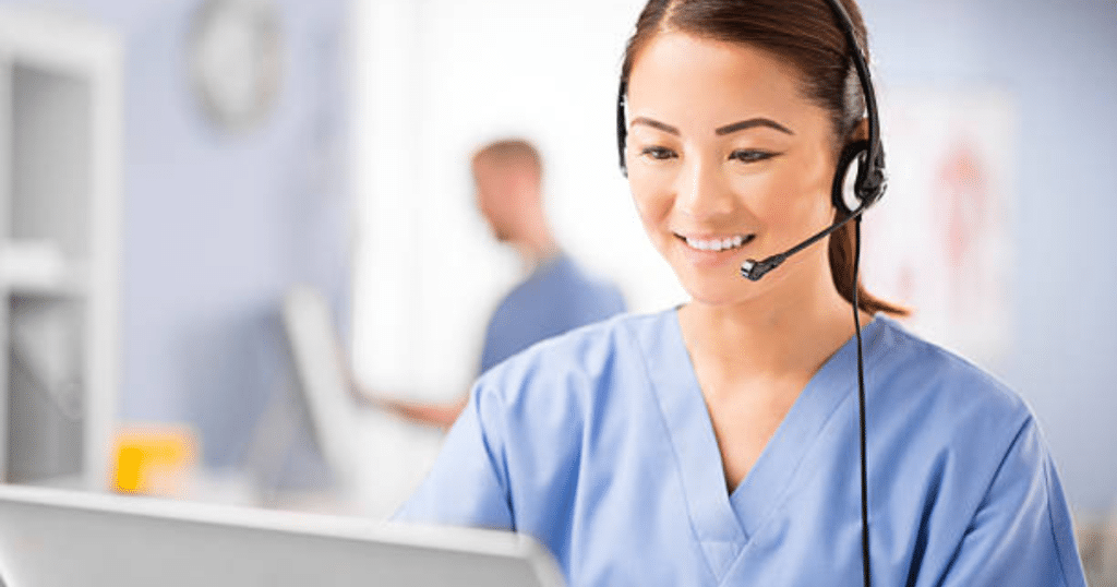 virtual scribe woman sitting with laptop and headset smiling