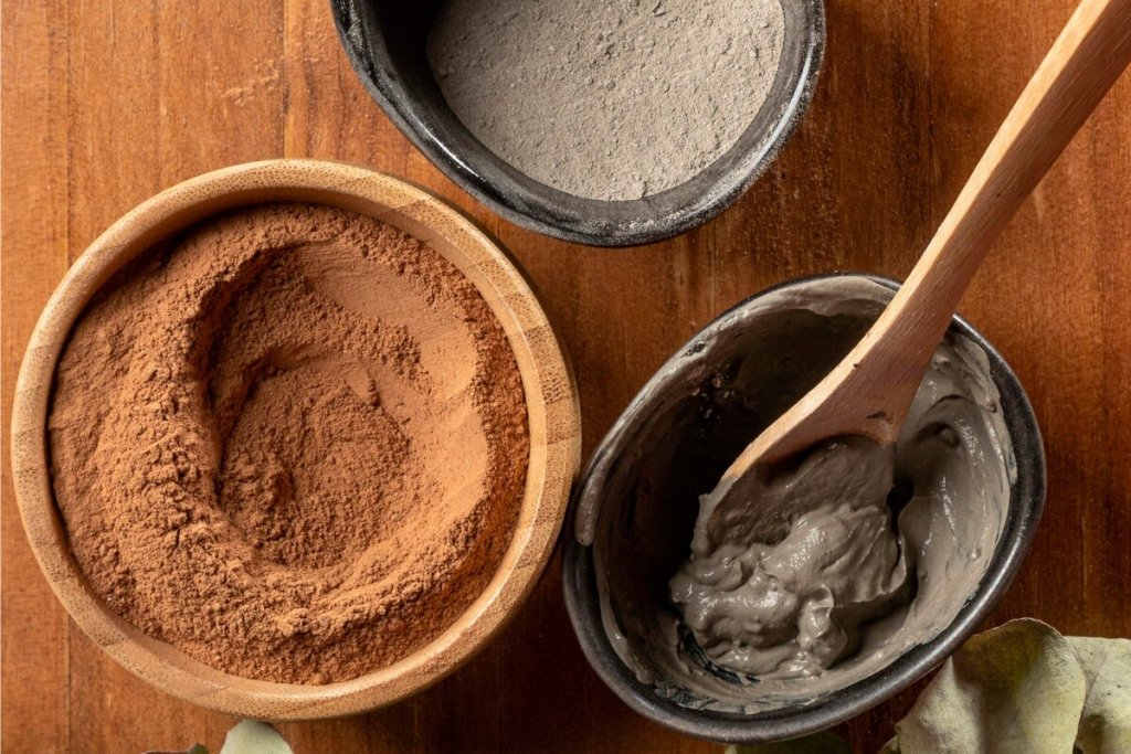 Two bowls of powder and one bowl of clay highlighting Lemnian Earth medicinal uses
