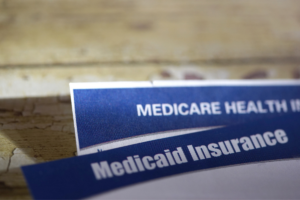 Coverage Transitions from Medicaid Expansion to Medicare: A Cohort Analysis